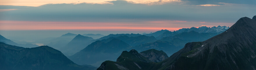 Fototapeta premium Sunrise over the Bernese alps with mountains Wildgaerst and Schwarzhorn in the foreground