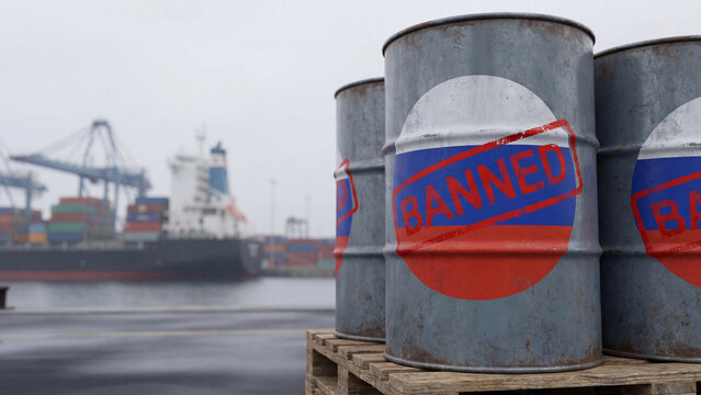 Russian oil barrels stamped banned at shipping port illustrating energy sanctions and trade embargo enforcement