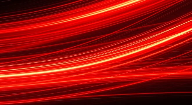 Abstract fiery red light trails evoking energy, speed, and dynamism in a dark background