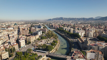 Fototapeta premium Aerial View of Traffic and Trees Along Segura River Promenade, Murcia, Spain