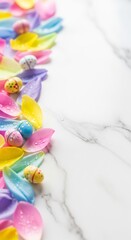 Obraz premium Colorful flower petals with water drops and small Easter eggs on white marble background, spring vertical composition with copy space.