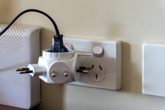 Overloaded Australian Wall Power Point and Multi Adapter Plug showing Electrical Safety Hazard and Fire Risk in Home Office