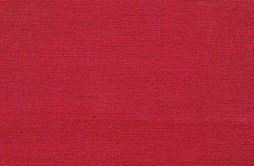 Fototapeta premium Red fine cotton canvas fabric pattern close up as background