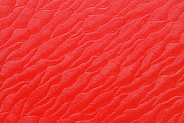 Abstract red texture, clean red waved structural surface as background