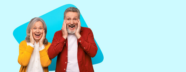 Fototapeta premium A couple smiles widely while standing together against a bright background. They are showing surprise and happiness with their expressions and hand gestures. Their outfits add warmth to the scene.