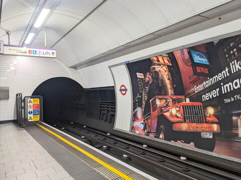 Empty platform and dark tunnel at Tottenham Court Road on the London Underground transit system