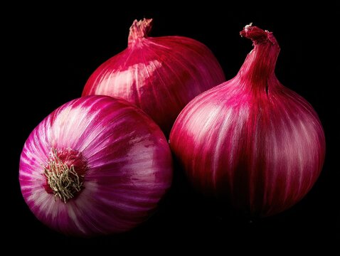 fresh red onions with rich textures on a clean white surface highlighting detailed layers and vibrant tones thanks to soft professional lighting isolated on a black background no text no watermark no