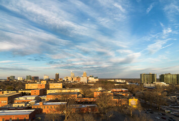 View of old buildings on the Dix Park campus with the Raleigh skyline in the distance