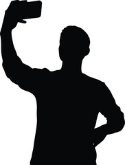 Silhouette of a man taking a selfie with a mobile phone in his hand