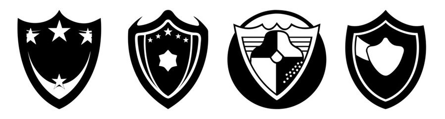 Fototapeta premium Set of four black and white heraldic shields with star, cross, and floral motifs for emblem design