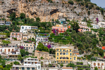 Fototapeta premium Iconic village of Positano Italy with main cathedral and colorful old buildings on the cliffs of the Amalfi Coast