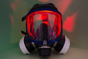 Exterminator&rsquo;s face mask with its filters, set in a colorful environment with colored lighting.
