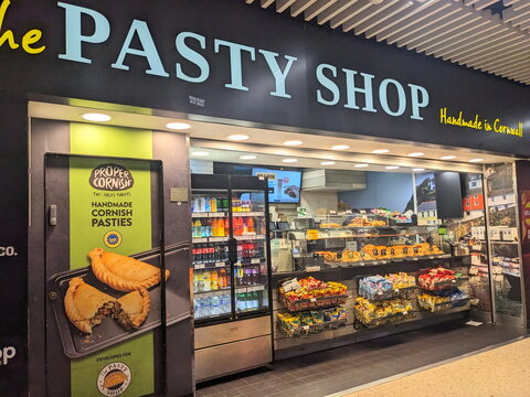 The inviting storefront of a traditional Pasty Shop selling Cornish pasties in London Euston