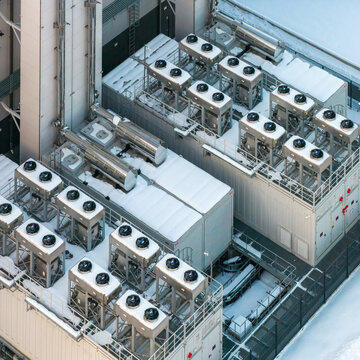 Aerial view of data center cooling and ventilation units. Essential infrastructure for technology and compute grids, Warszawa, Wojewodztwo mazowieckie, Poland.