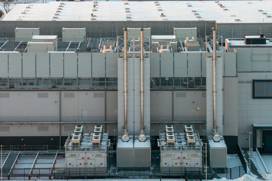 Aerial view of a modern data center infrastructure featuring cooling and ventilation systems supporting large scale cloud computing and it operations, Warszawa, Wojewodztwo mazowieckie, Poland.