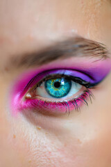 Eye with Bold Purple Makeup A Striking Close-Up of a Human Eye Enhanced with Vibrant Purple Eyeshadow and Liner, Showcasing Dramatic Cosmetics and Artistic Expression
