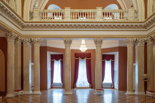 Luxury classical interior with marble columns and red curtains