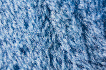 Close-up of Soft Blue Textured Fabric © Marina