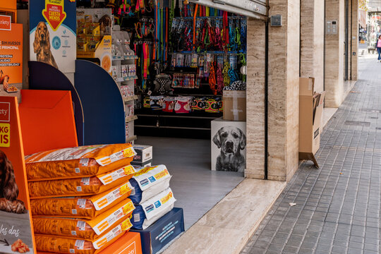 Barcelona, Spain&mdash;January 15, 2026. Pet shop storefront displaying dog food and accessories