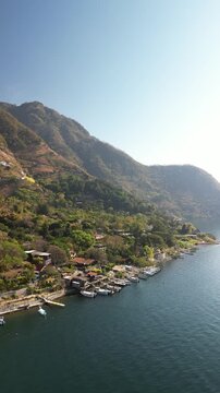 Vertical aerial Santa Cruz la Laguna Lake Atitlan Guatemala on sunny day in dry season