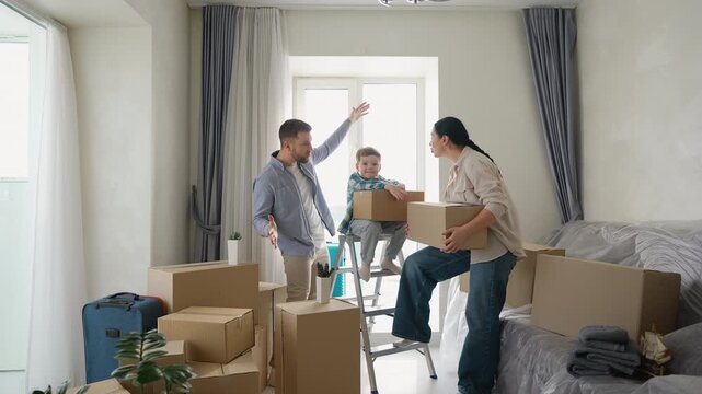 Frustrated parents arguing while moving to new home