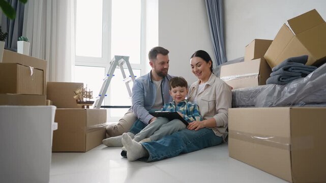 Young happy family planning renovation in new home together