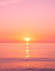 Fototapeta premium Seascape at Sunset with Pink and Orange Sky Reflecting on Water