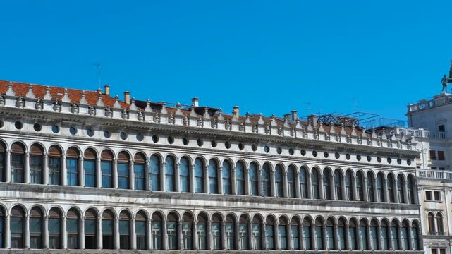 Procuratie vecchie in venice, italy. Procuratie vecchie, a historic building in st. Mark's square, venice, with a clear blue sky providing a backdrop