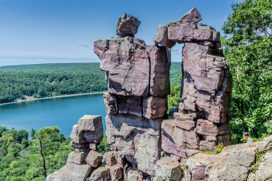 A large rock formation with a small opening in the middle
