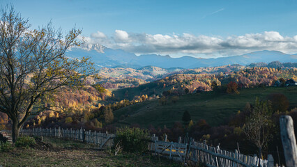 Autumn Rural Landscape with Wooden Fence and Mountain Hills