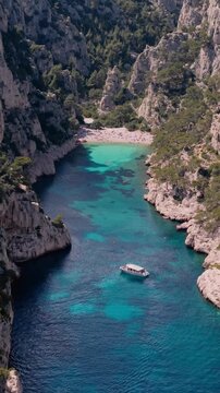 Calanques National Park near Cassis, Aerial view, showing steep limestone cliffs and turquoise water with tour boats