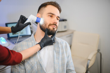 Naklejka premium Patient receiving hair and beard growth examination