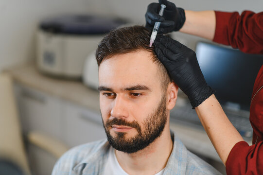 Man receiving hair mesotherapy injections for scalp treatment