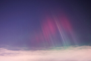 Fototapeta premium Nordic Aurora Borealis Over Cloud Layer and Starry Night Sky