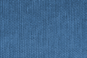 Blue upholstery fabric, textile texture with detailed woven textile pattern, close up, macro. Cloth background for interior design, furniture, wallpapers, decor, packaging and creative backdrops.