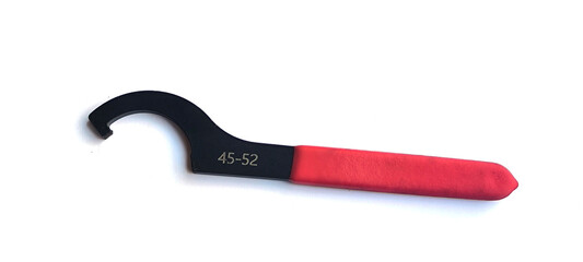 Obraz premium Hook spanner wrench used . Made from high carbon steel. Features a red. non slip rubberized grip.