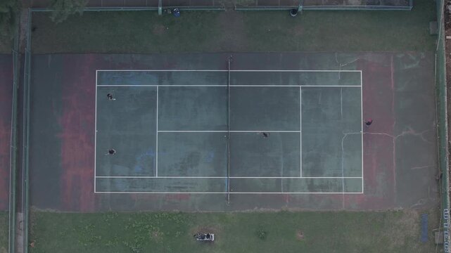 Tennis game in an old court