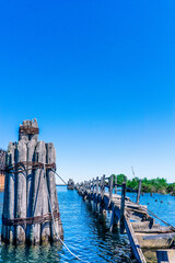 Fototapeta premium A wooden pier with a rope tied to it