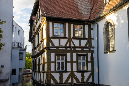 Spitalkirche St. Katharina along the Wiesent River in Forchheim, Bavaria, Germany old town architecture and Franconian heritage.