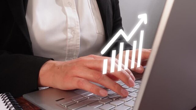 Close-up of a professional woman's hands using a computer with an animated "Innovation" featuring rocket, gear, and arrow icons.