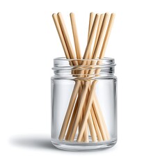 Glass jar filled with bamboo sticks, kitchen utensils for cooking, and culinary preparation