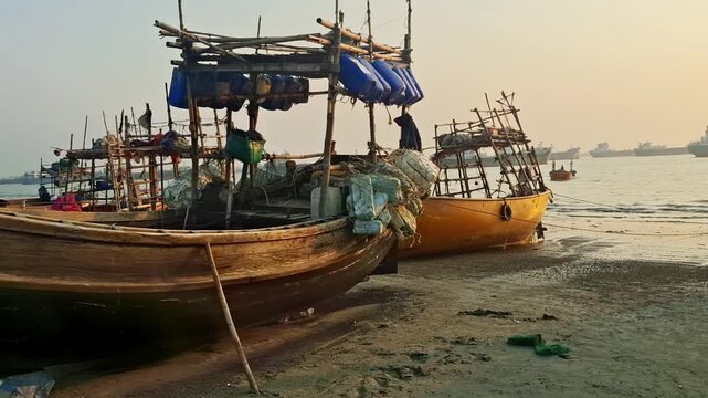 Fishing boats in Chittagong sail across the vast waters of the Bay of Bengal, carrying local fishermen who depend on the sea for their livelihood.