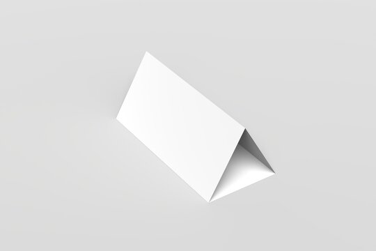Minimalist blank white tent card mockup in a triangular folded shape, standing on a clean neutral background. Perfect for showcasing table name cards, restaurant menus, event signage, promotional.