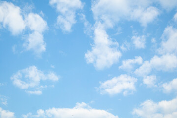 Fototapeta premium Beautiful blue sky with white clouds on a sunny day background
