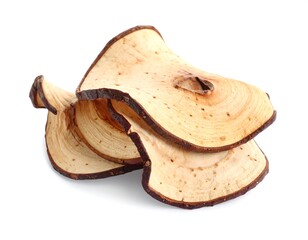 Stack of dehydrated apple slices on a white background, light beige and brown