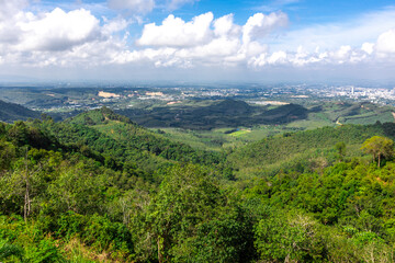 Fototapeta premium Panoramic nature background On a high mountain, you can see the scenery of trees, grass, and lush rice fields. While traveling on an adventure trip