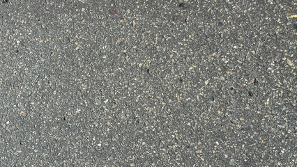Fototapeta premium Background texture of dark gray or gray asphalt, top view. texture. Road background. Above, high angle. Copy space, empty space, free space. flat lay. close up. black.