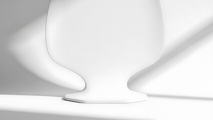 Elegant white vase on modern surface with soft shadows