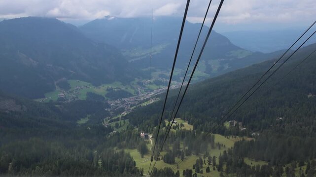cable cars in the italian alps (dolomites italy) ortisei seceda alpe di siusi val gardena ski lift (view of beautiful mountains in the background) travel tourism destination europe european trip