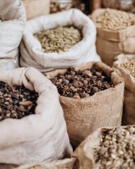 Exotic Spices Displayed in Burlap Sacks at a Traditional Outdoor Market for Food Blog Content, Culinary Ingredients and Authentic Middle Eastern Bazaar Atmosphere